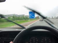 Picture of the Welcome to Scotland sign in the rain